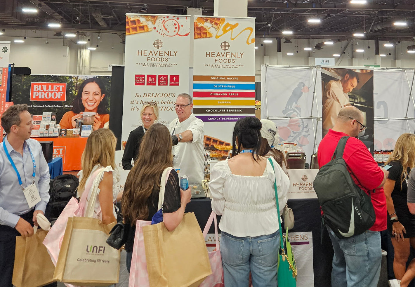 Chef Bob Haney the founder of Heavenly Waffles and wife Cathy Haney at UNFI show in Las Vegas serving Heavenly Foods.
